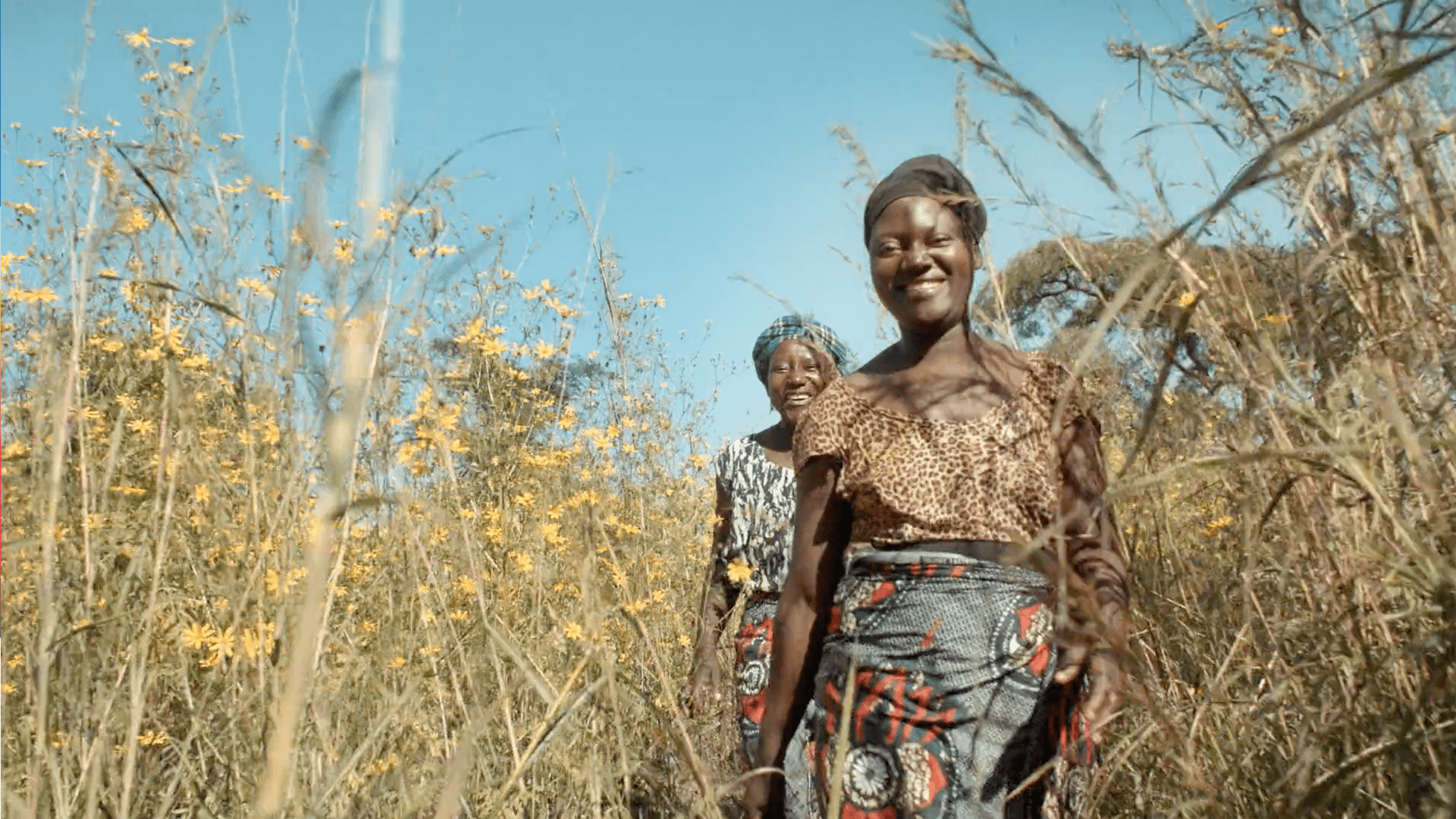 Still from the VANDAL produced World Vision commercial featuring two women walking through tall grass