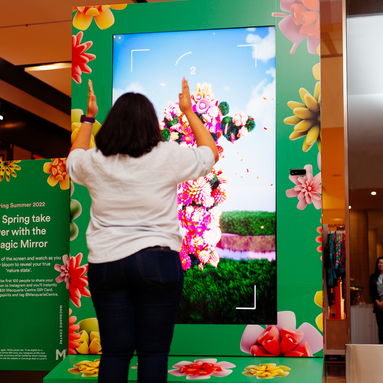 Shoppers interacting with the VANDAL Magic Mirror™ for the Macquarie Center 'Spring Into Action' Experiential campaign