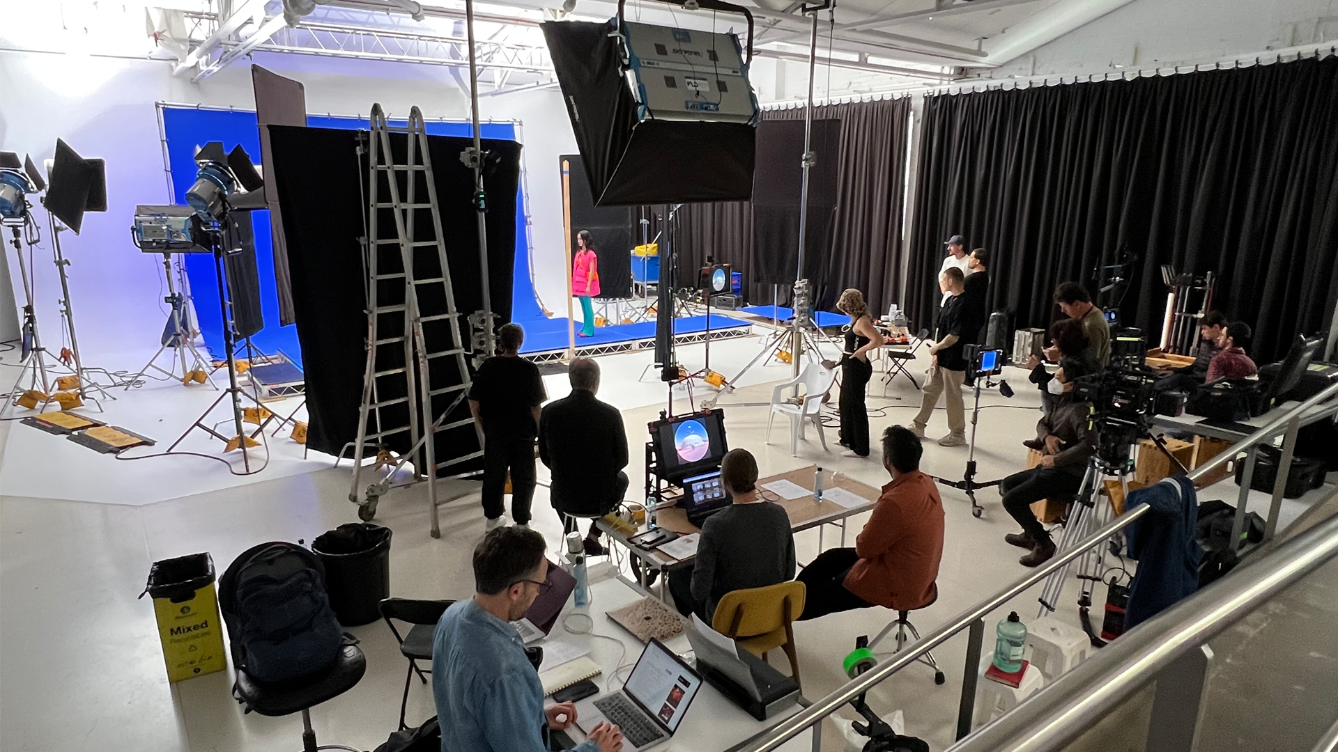 People standing in a photography studio.