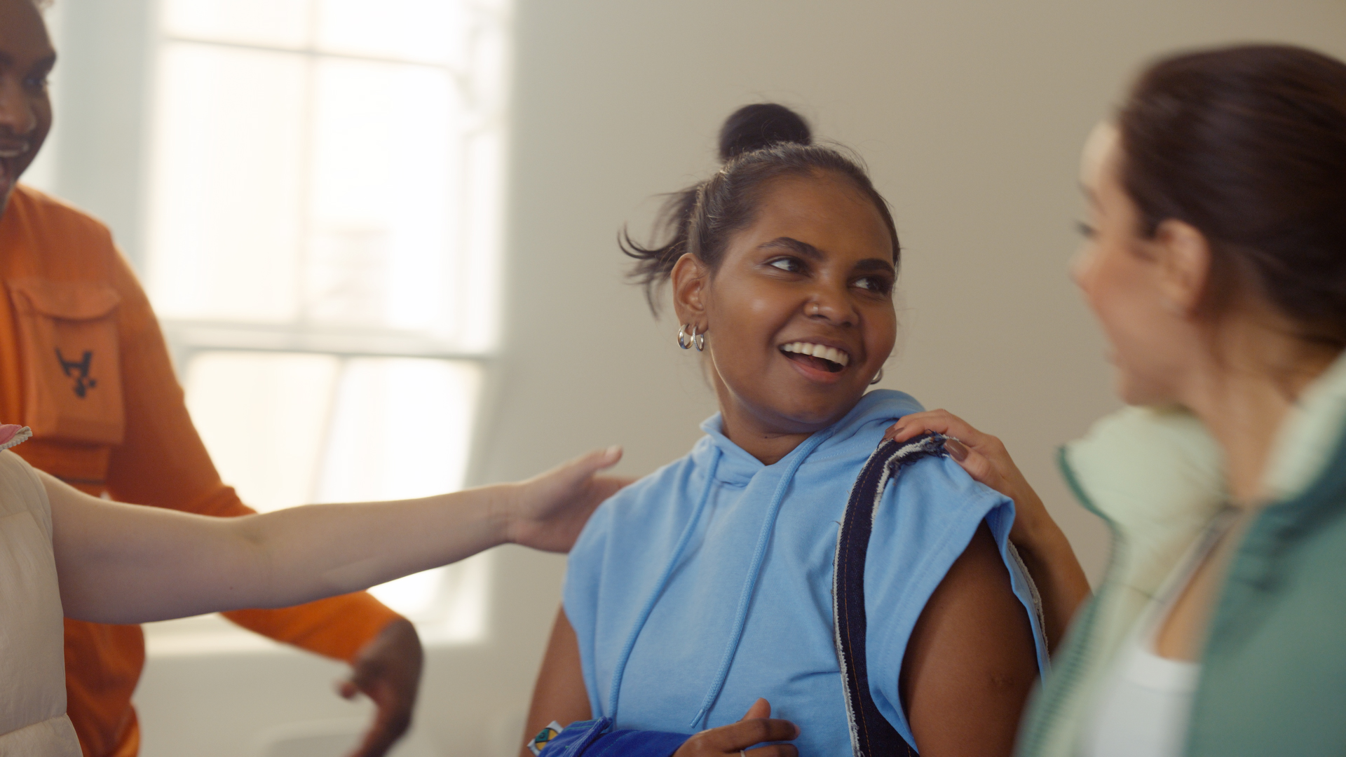 Still from google Helpfulness campaign TVC featuring young people together laughing