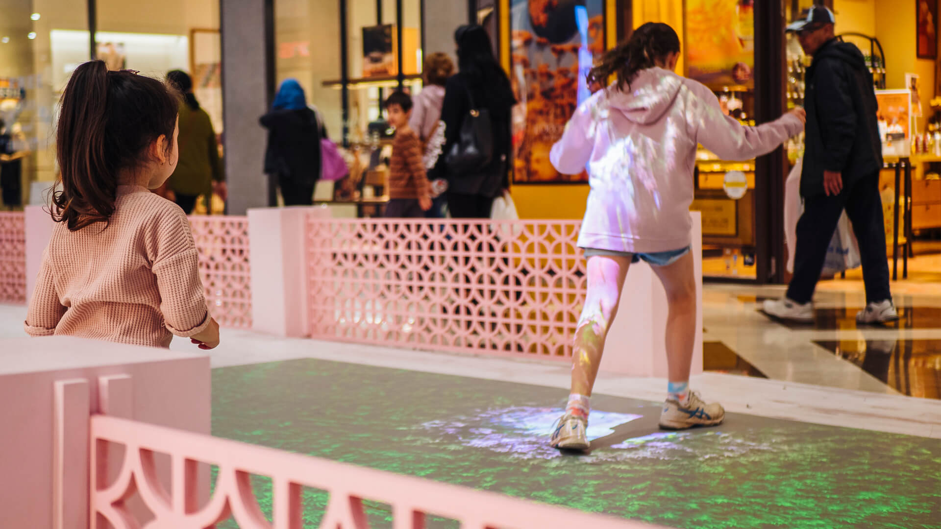 Shoppers enjoying the Macquarie Center Uplifting Spirits Spring experiential brand activation by VANDAL