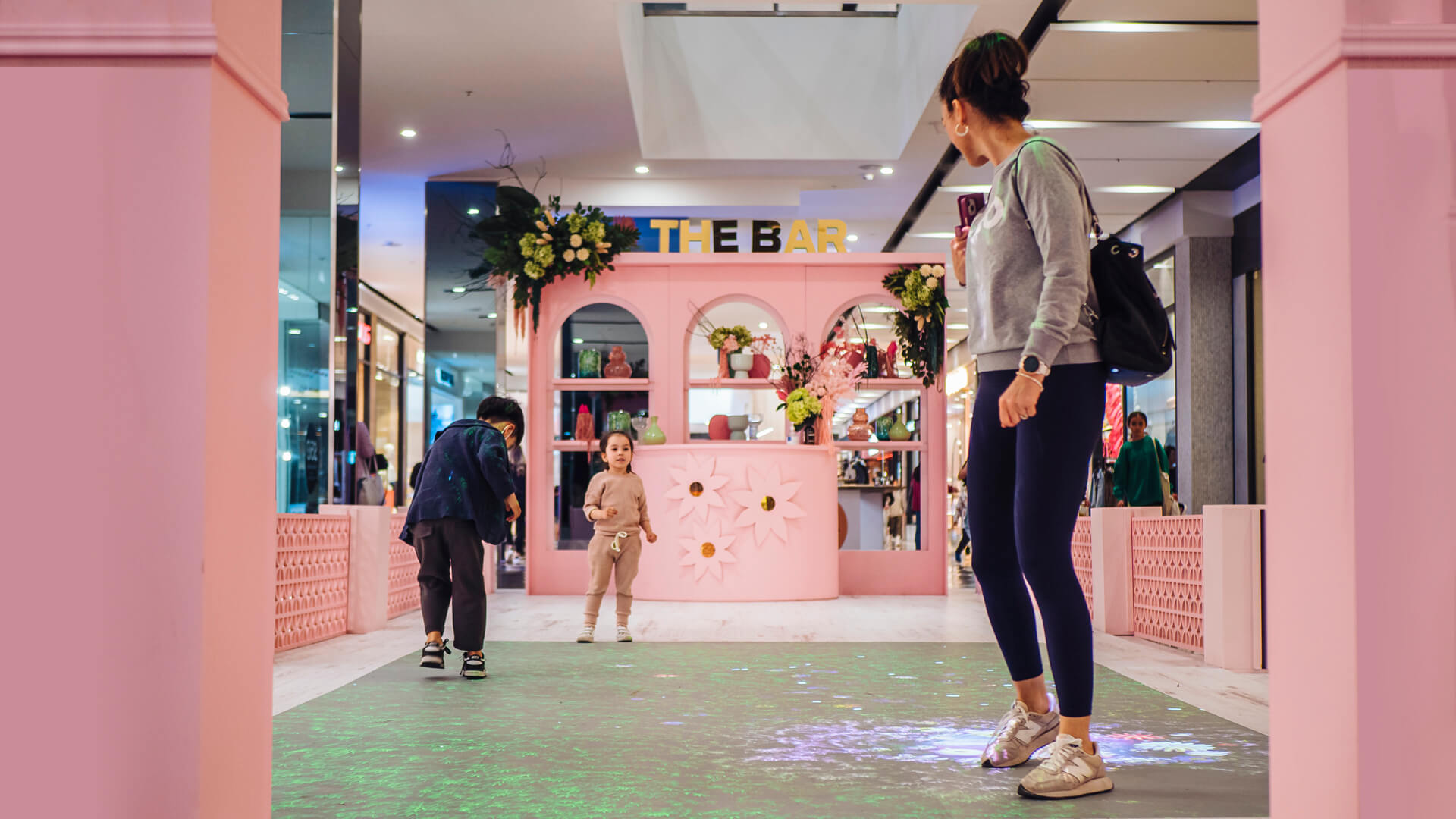 Shoppers enjoying the Macquarie Center Uplifting Spirits Spring experiential brand activation by VANDAL