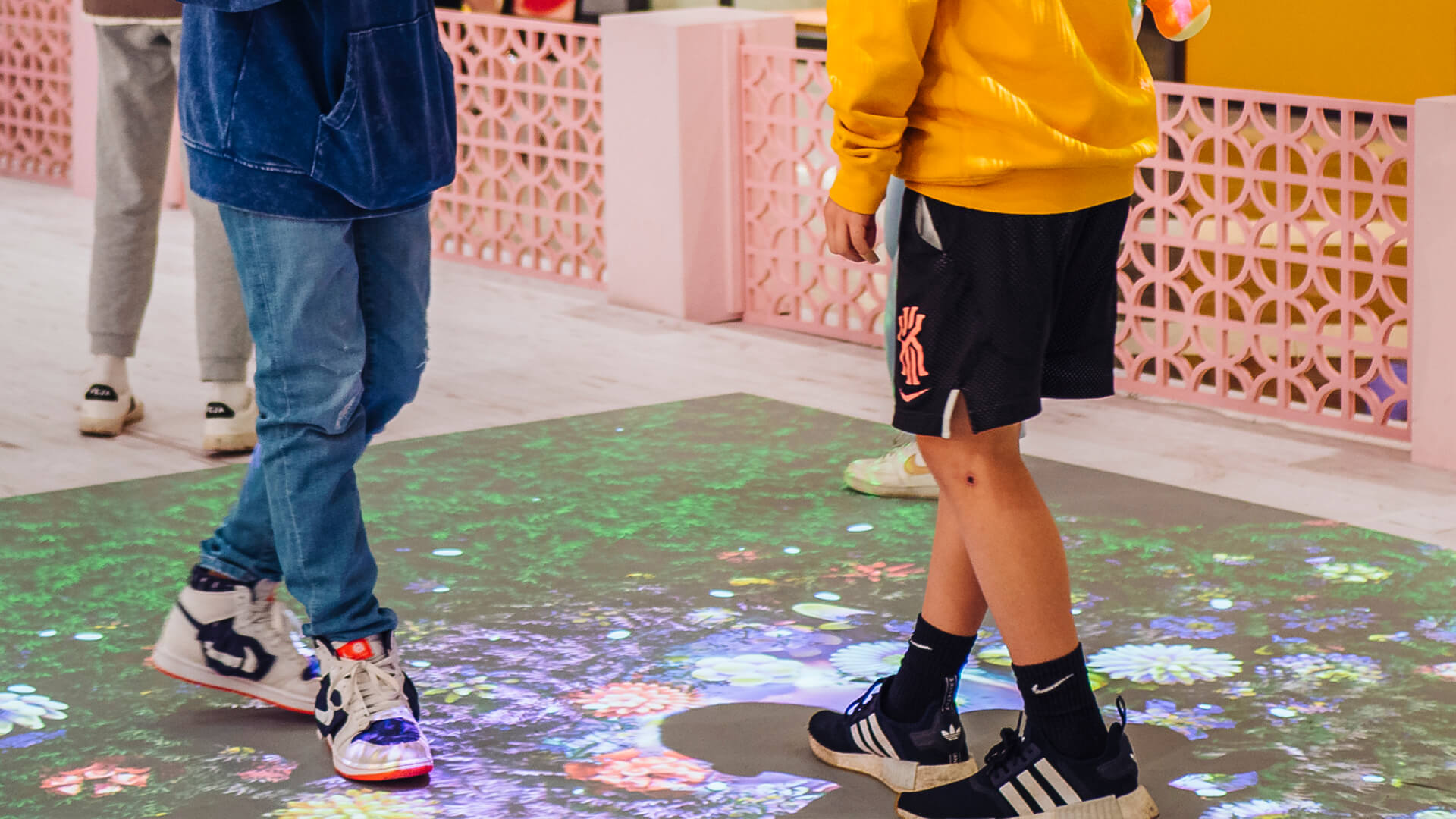 Shoppers enjoying the Macquarie Center Uplifting Spirits Spring experiential brand activation by VANDAL