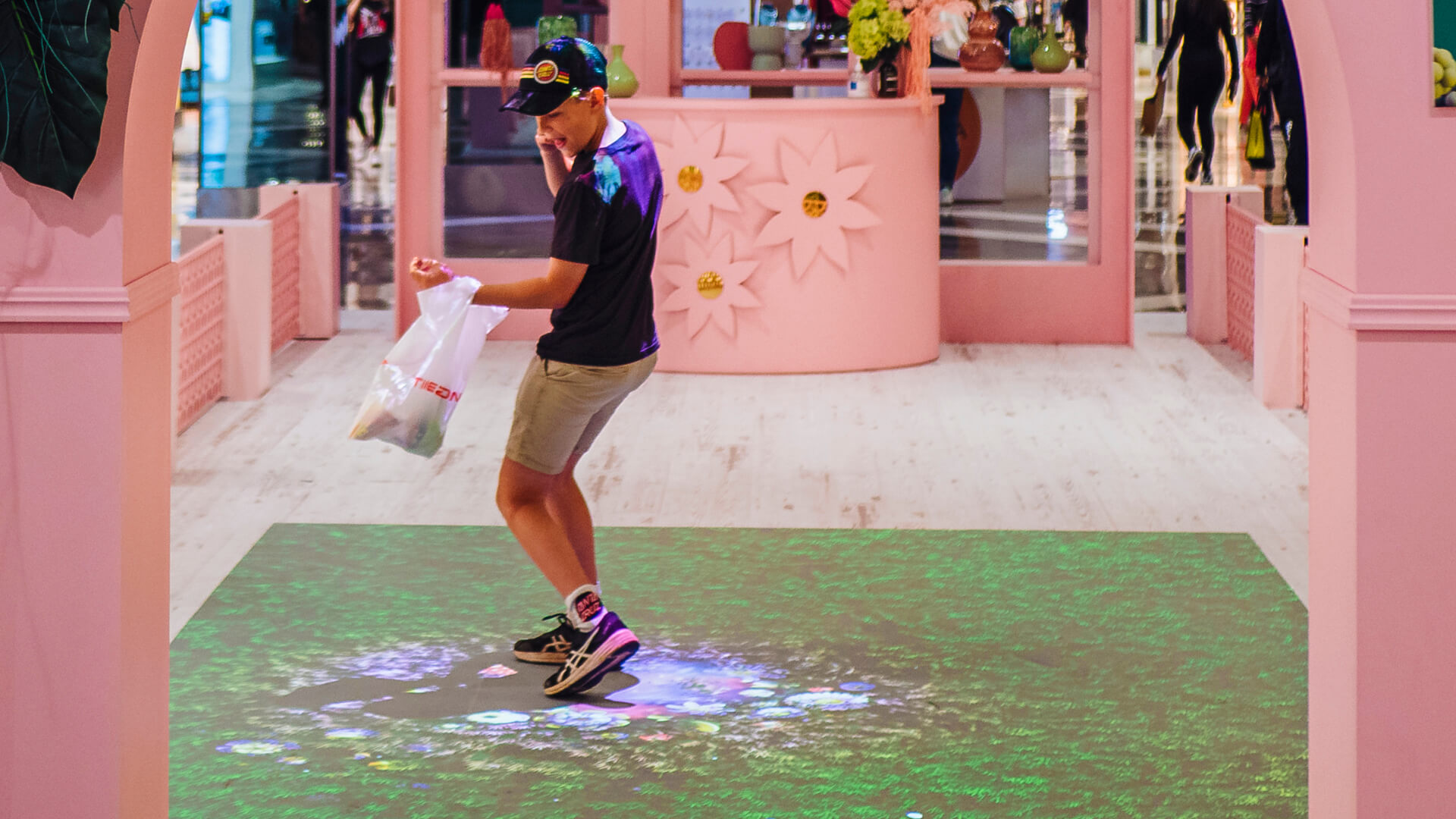 Shoppers enjoying the Macquarie Center Uplifting Spirits Spring experiential brand activation by VANDAL